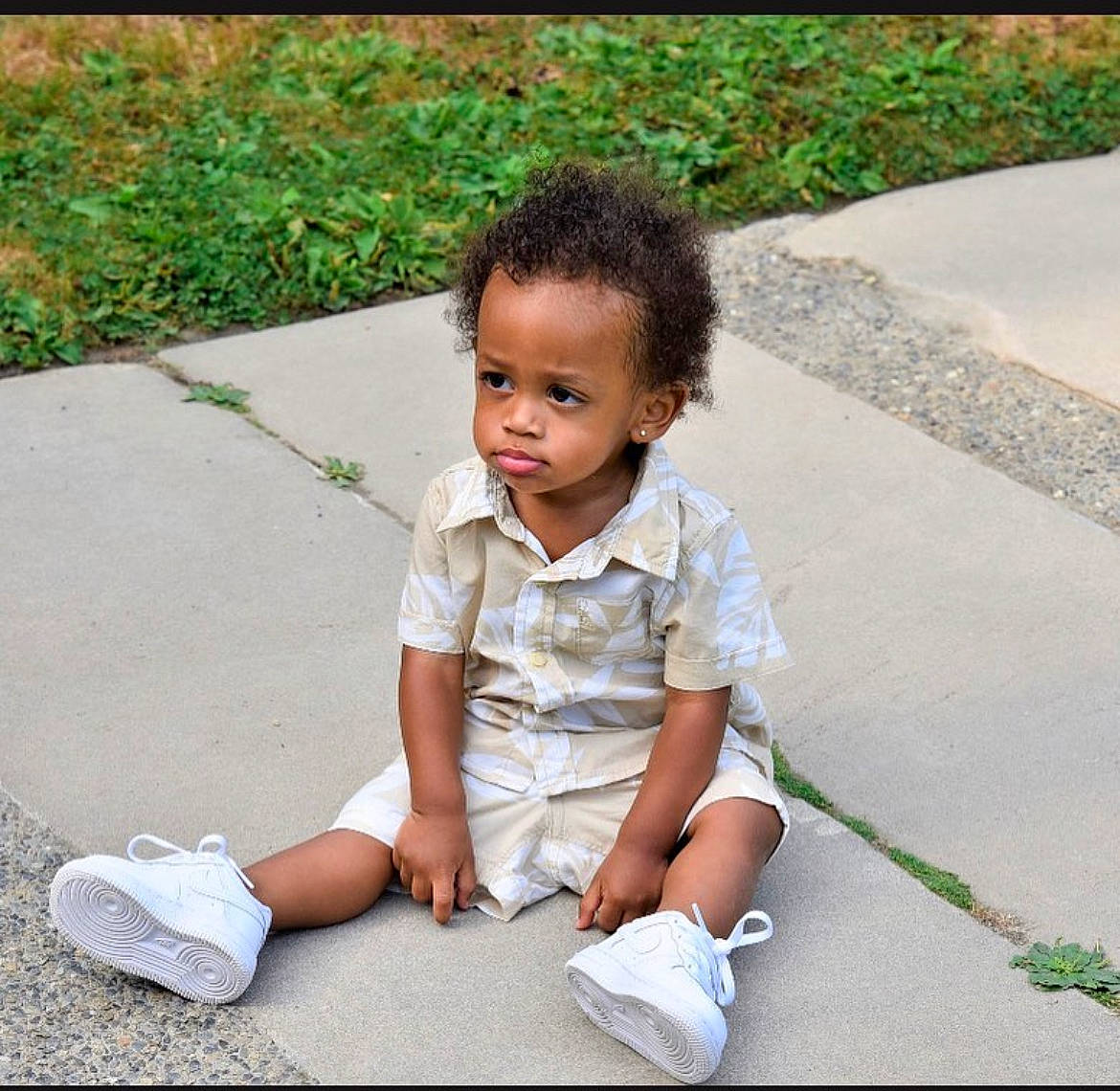 Nasir joined the competition — help win amazing prizes! asphalt, child, face, footwear, grass, hair, human_leg, knee, leisure, people_in_nature, person, photograph, plant, public_space, road_surface, shoe, sidewalk, snapshot, sneakers, toddler