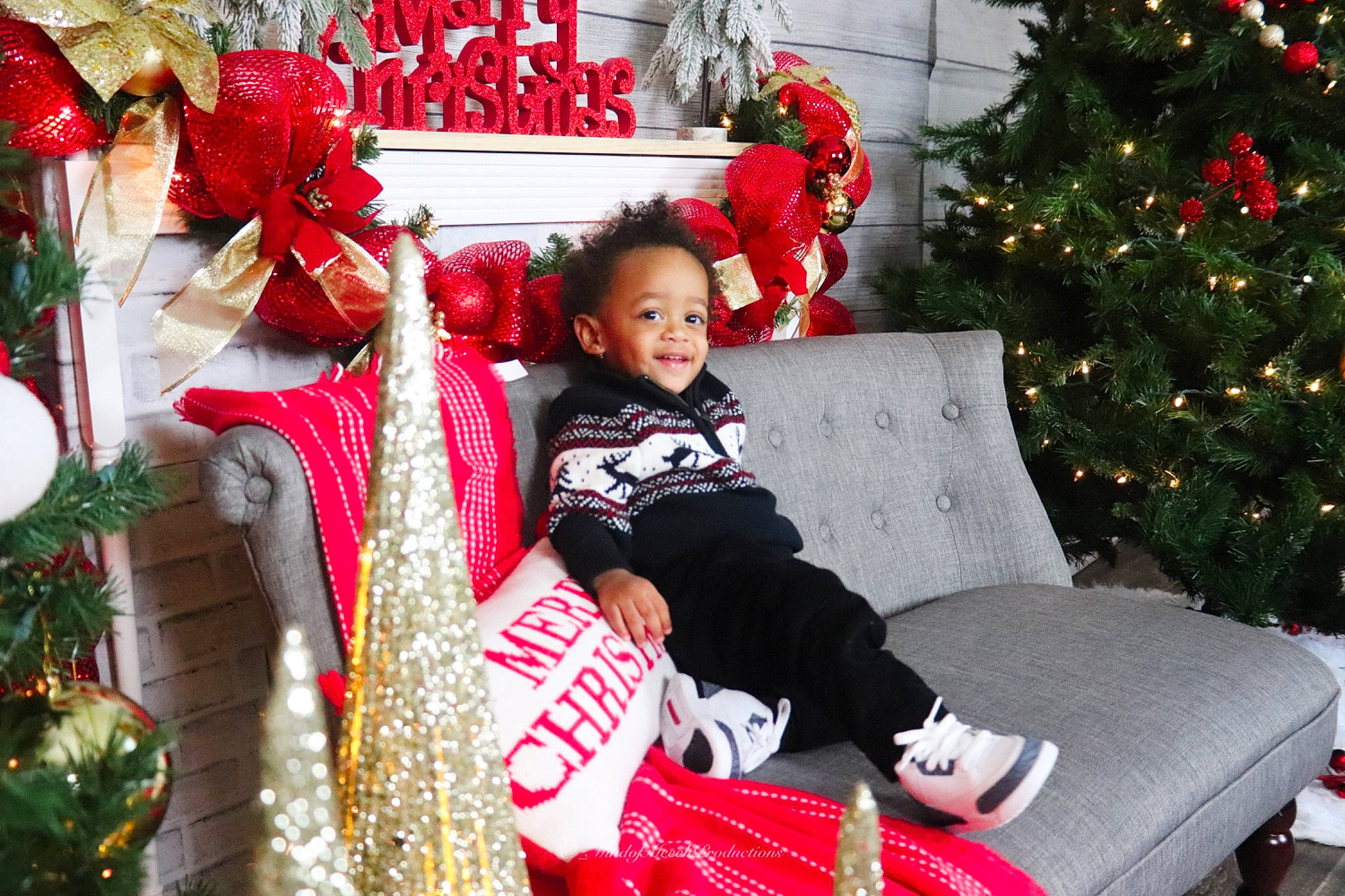 Nasir joined the competition — help win amazing prizes! christmas_decoration, christmas_eve, christmas_ornament, christmas_tree, decoration, event, happy, holiday, holiday_ornament, human_body, joy, lap, ornament, person, photograph, plant, red, smile, snapshot, toddler