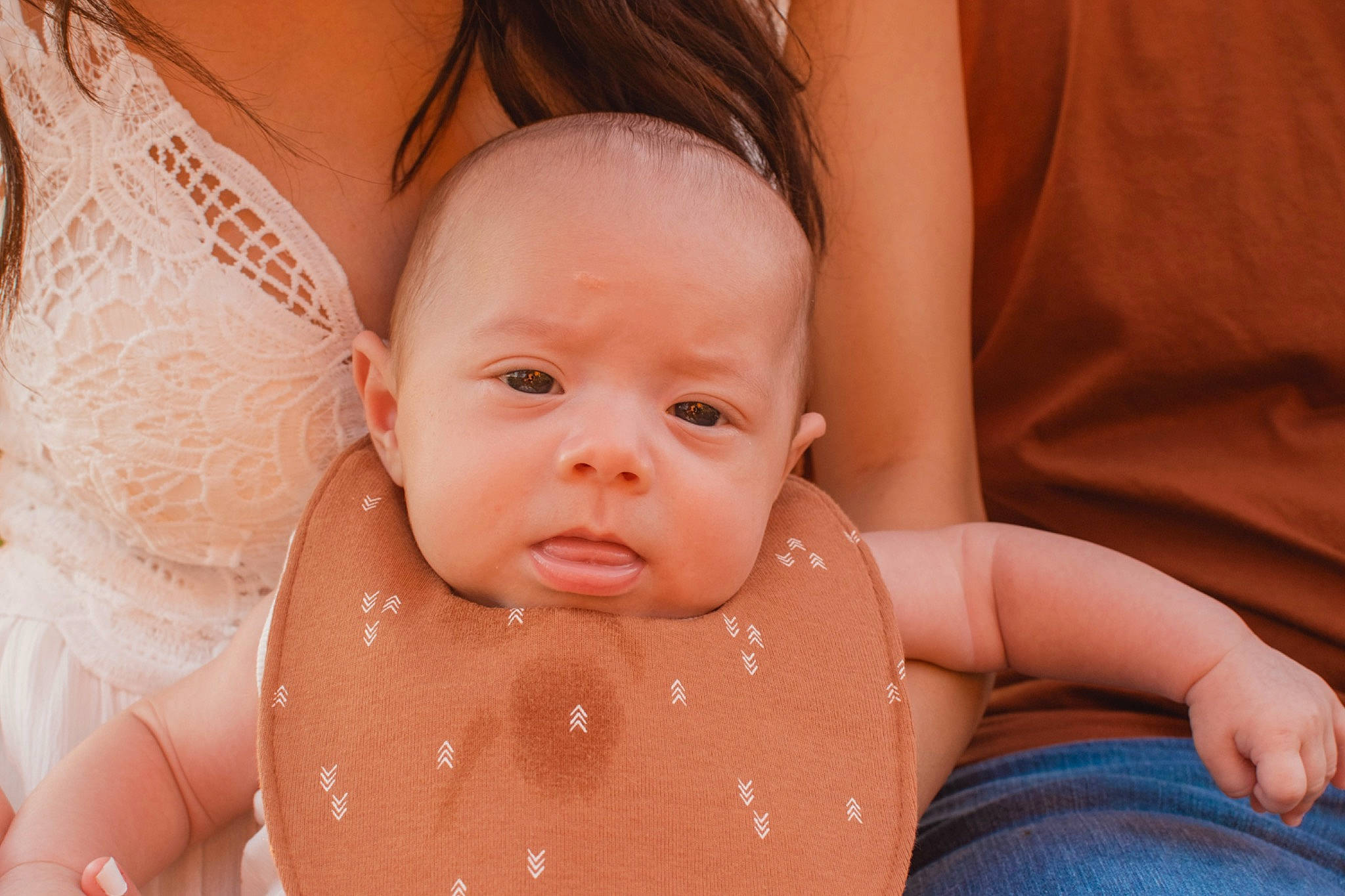 Maddux is registered to the contest to win money with this photo: arm, baby, baby_toddler_clothing, cheek, comfort, eye, face, facial_expression, finger, gesture, hand, happy, head, iris, lip, mouth, nose, person, skin, stomach