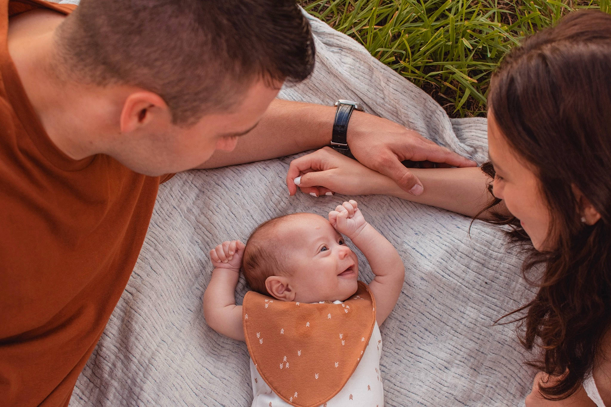 Maddux joined the competition — help win amazing prizes! arm, baby, child, event, finger, fun, gesture, grass, hand, happy, jewellery, mouth, nail, people_in_nature, person, plant, sitting, skin, toddler, watch