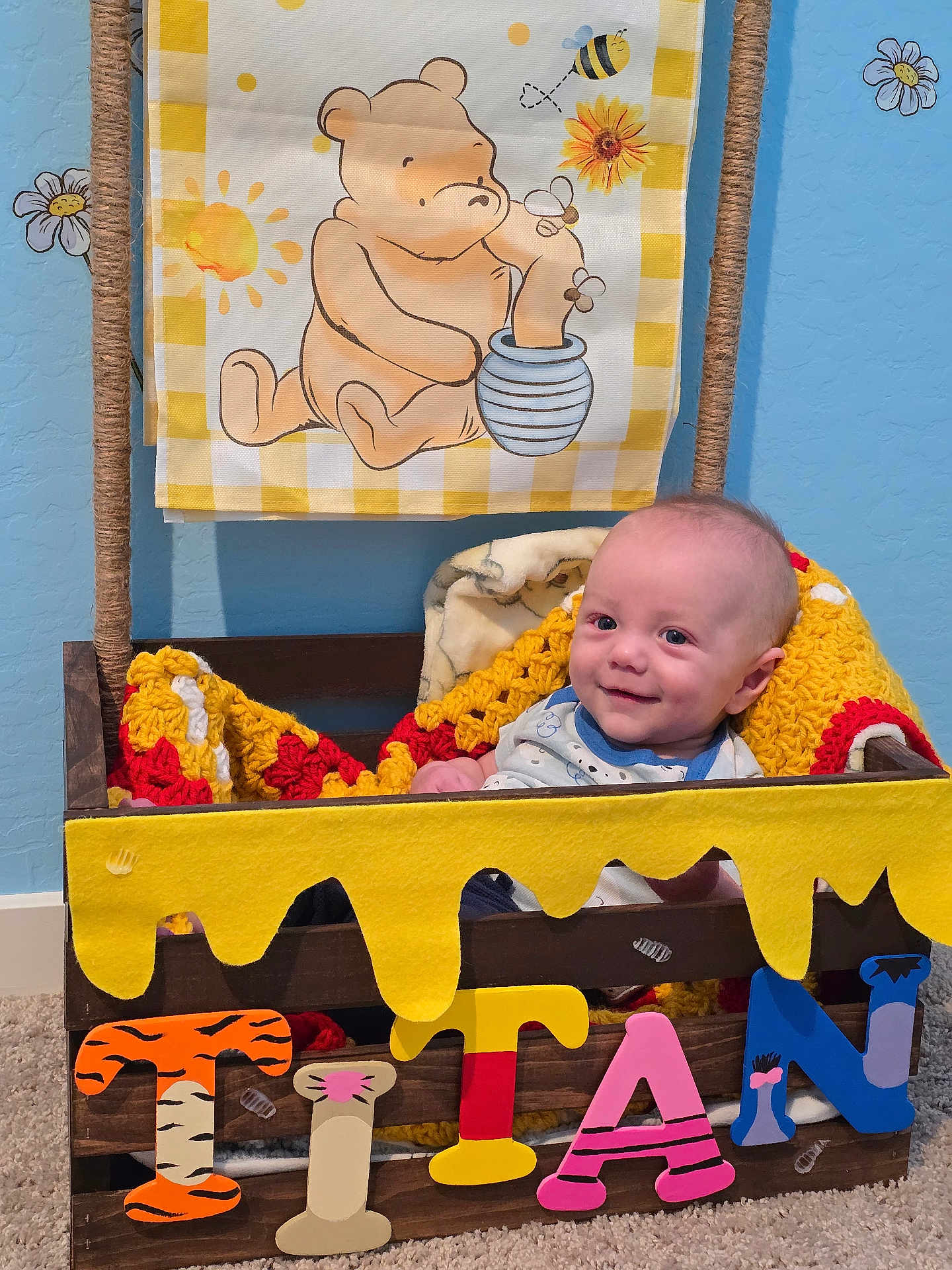 Titan joined the competition — help win amazing prizes! baby, crate, blanket, crochet, wood, letters, felt, winnie_the_pooh, nursery, decor, blue_wall, daisy, smile, child, carpet, rope, cute, infant, person, indoor