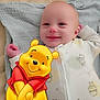 baby, smiling, blanket, onesie, cartoon, winnie_the_pooh, character, digital_art, cute, lying_down, infant, soft_texture, child, happy, bedtime, toddler, illustration, playful, portrait, cozy