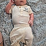 baby, infant, clothing, blanket, soft_texture, lying_down, cute, portrait, child, cozy, elephant_print, fabric, feet, hands, looking_up, comfortable, casual_wear, indoor, relaxed, person