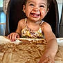 toddler, child, smiling, happy, high_chair, chocolate, messy, face, hand, food, table, indoor, clothing, baby, cute, portrait, playful, dirt, fun, expression