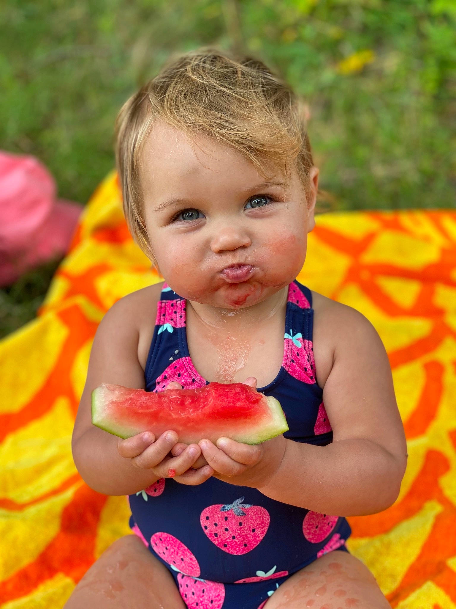 Bexley joined the competition — help win amazing prizes! baby_playing_with_toys, dress, finger, grass, hairstyle, hand, happy, head, human_body, leisure, lip, nail, neck, orange, people_in_nature, person, pink, skin, summer, toddler