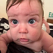 Bradley joined the competition — help win amazing prizes! baby, close_up, face, blue_eyes, infant, skin, blanket, curious, expression, lying_down, soft_light, indoors, child, person, young, cute, portrait, head, human, skin_texture