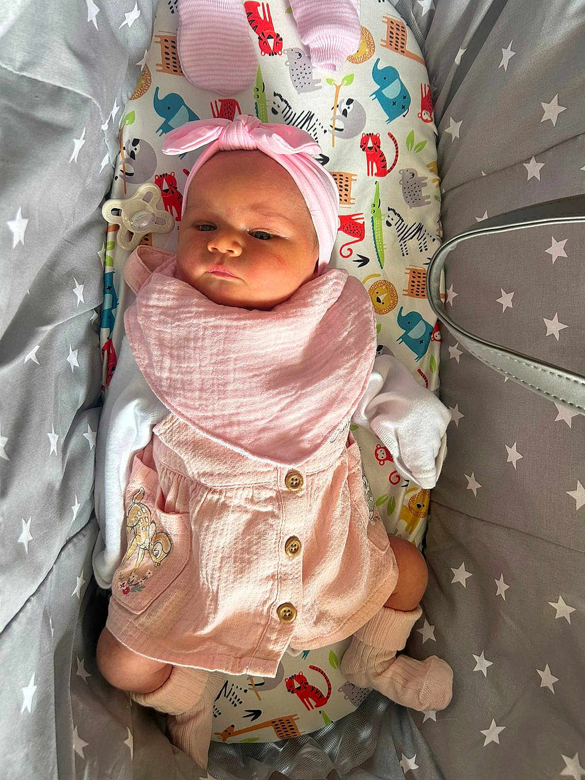 Ava Rose is registered to the contest to win money with this photo: baby, infant, pink_clothing, headband, socks, pacifier, animal_print, cushion, star_pattern, bedding, cute, portrait, child, indoor, soft_lighting, newborn, comfortable, lying_down, adorable, cozy