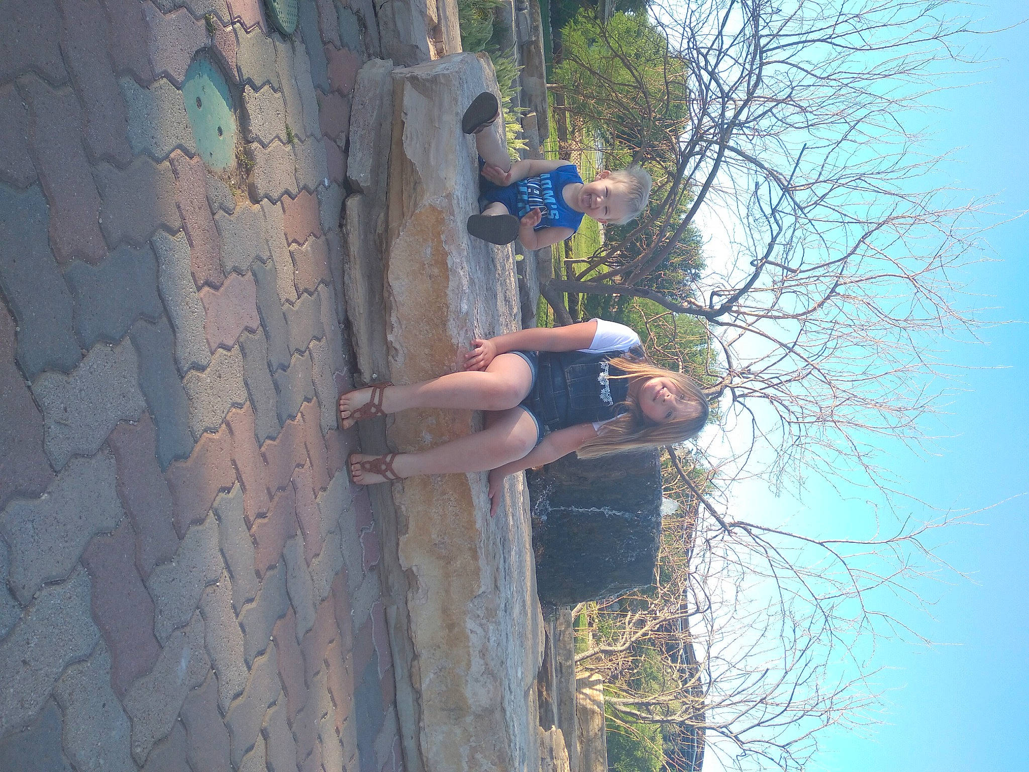 Sierra is registered to the contest to win money with this photo: adventure, azure, concrete, daytime, elbow, electric_blue, fun, joy, leg, leisure, nature, people_in_nature, person, plant, recreation, sky, t_shirt, tree, trunk, twig