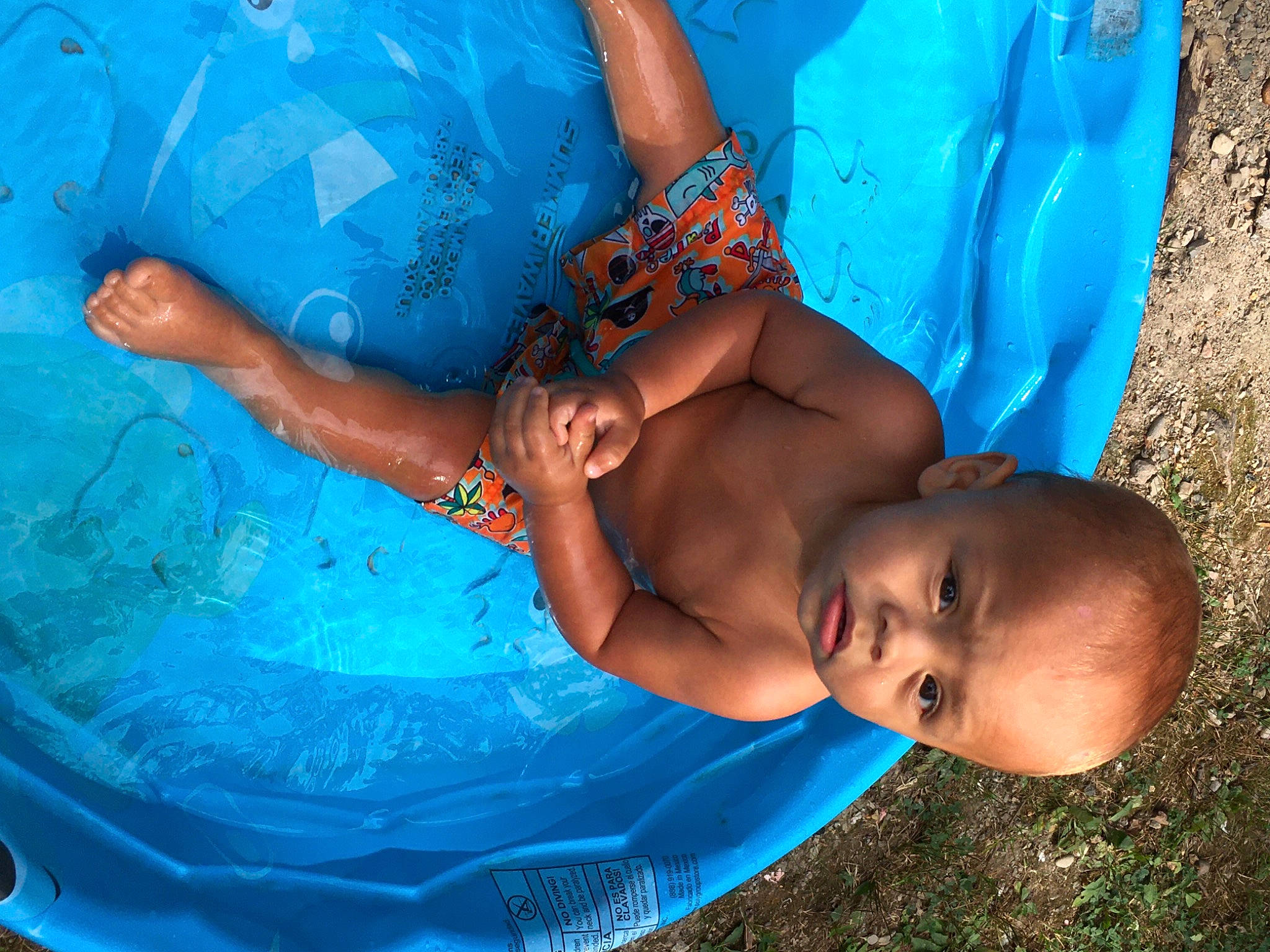 Gionni is registered to the contest to win money with this photo: baby, bathing, blue, child, fun, leisure, person, smile, toddler, vacation, water