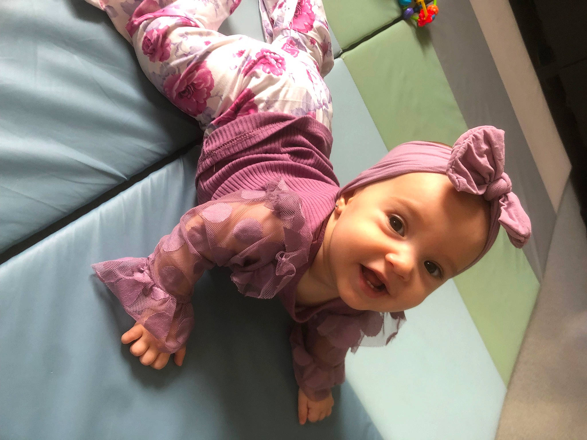 Nour participe au concours pour gagner de l'argent avec cette photo : baby, baby_toddler_clothing, beauty, cheek, comfort, flooring, fun, gesture, happy, headgear, leisure, magenta, mouth, nose, person, pink, purple, skin, sleeve, smile