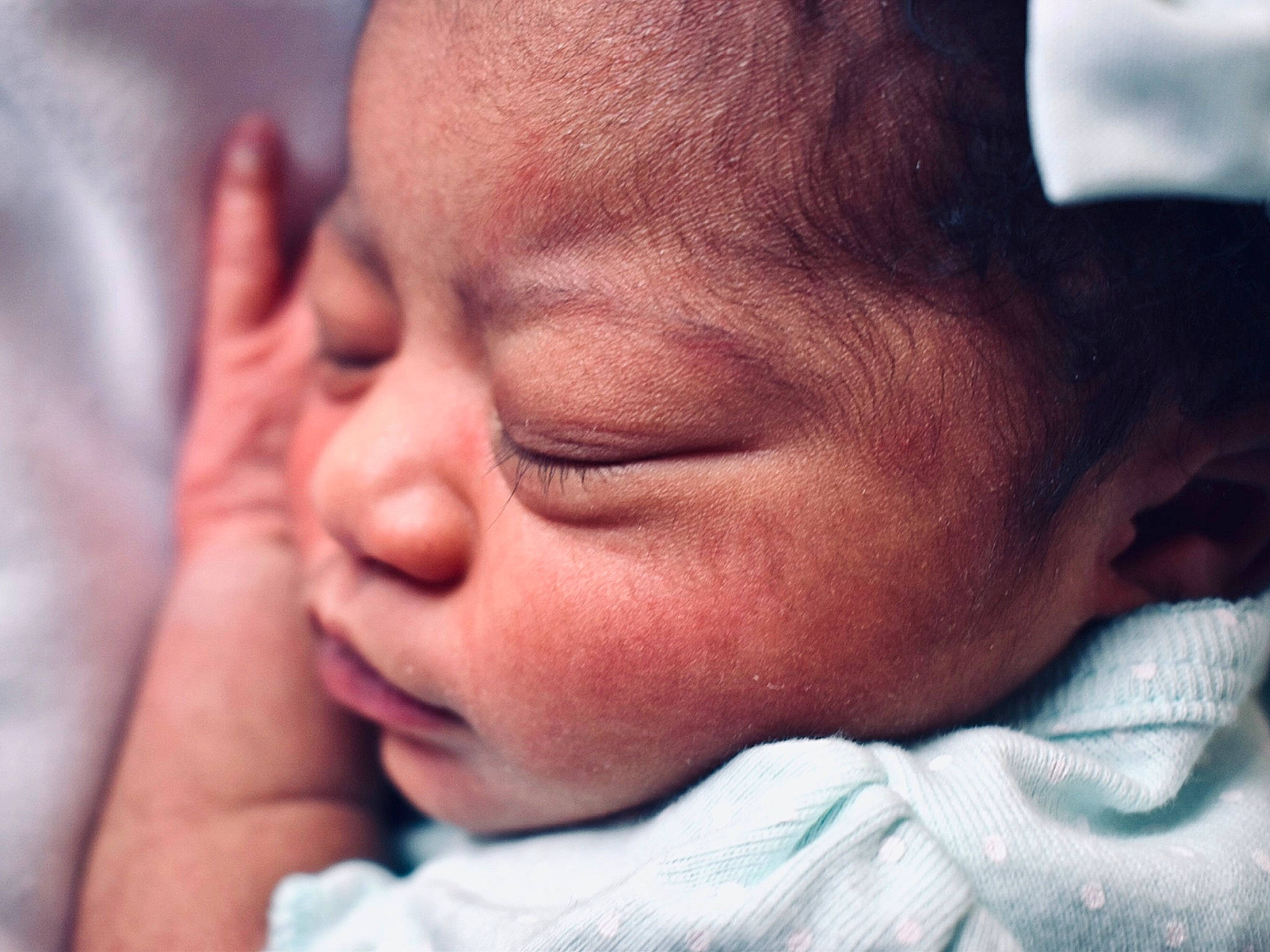 Jniya is registered to the contest to win money with this photo: baby, cheek, child, chin, close_up, eye, face, facial_expression, forehead, hand, head, human, lip, love, nap, nose, person, skin, sky, sleep