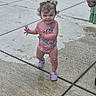 Nyx joined the competition — help win amazing prizes! toddler, child, sidewalk, concrete, wet, swimsuit, flamingo, purple_shoes, curly_hair, hair_bows, smile, walking, outdoor, person, feet, playful, summer, sunny, cute, happy