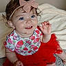 Nyx is registered to the contest to win money with this photo: toddler, child, smiling, blue_eyes, pink_bow, headband, red_tutu, strawberry_pattern, shirt, carpet, indoor, happy, cute, sitting, baby, clothing, face, person, young_child, playful