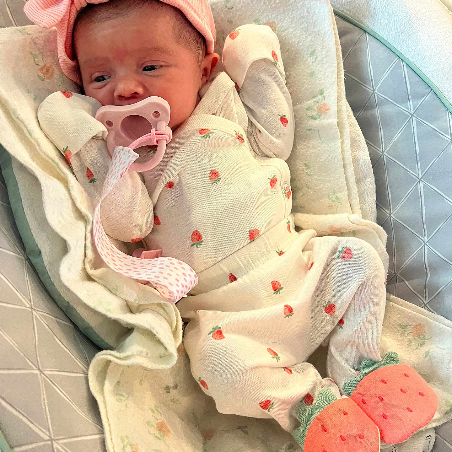 Sophia is registered to the contest to win money with this photo: adorable, baby, baby_clothes, baby_seat, blanket, booties, child, cozy, cute, headband, indoor, infant, lying_down, newborn, pacifier, pink_bow, resting, sleepwear, soft, strawberry_pattern