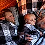 baby, man, sleeping, blanket, bed, pillow, indoor, wooden_wall, cozy, rest, peaceful, matching_blankets, portrait, face, head, comfort, nap, person, sleep, family