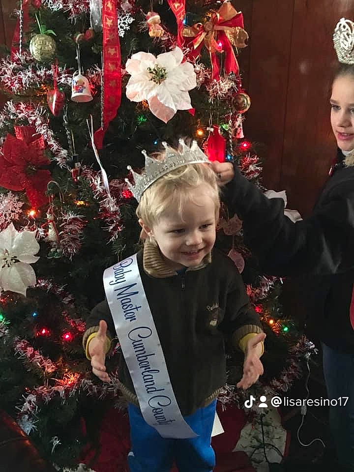 Jaylee is registered to the contest to win money with this photo: christmas, christmas_decoration, christmas_eve, christmas_ornament, christmas_tree, event, fun, happy, holiday, holiday_ornament, joy, ornament, person, plant, red, smile, standing, toddler, tradition, tree