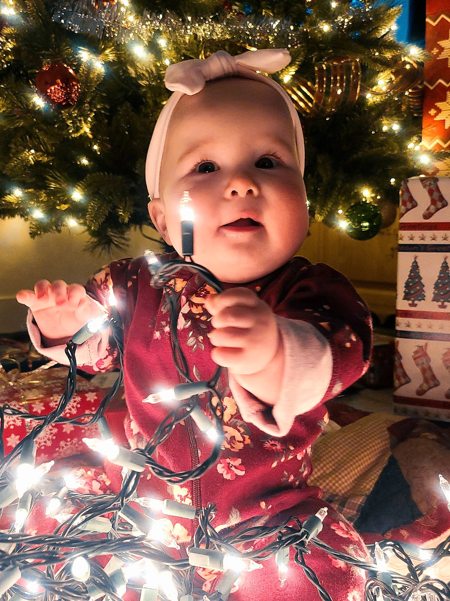 Aviana is registered to the contest to win money with this photo: baby, baby_toddler_clothing, beauty, cheek, christmas, christmas_decoration, christmas_eve, christmas_ornament, christmas_tree, conifer, event, fun, happy, head, holiday, holiday_ornament, ornament, person, sleeve, toddler