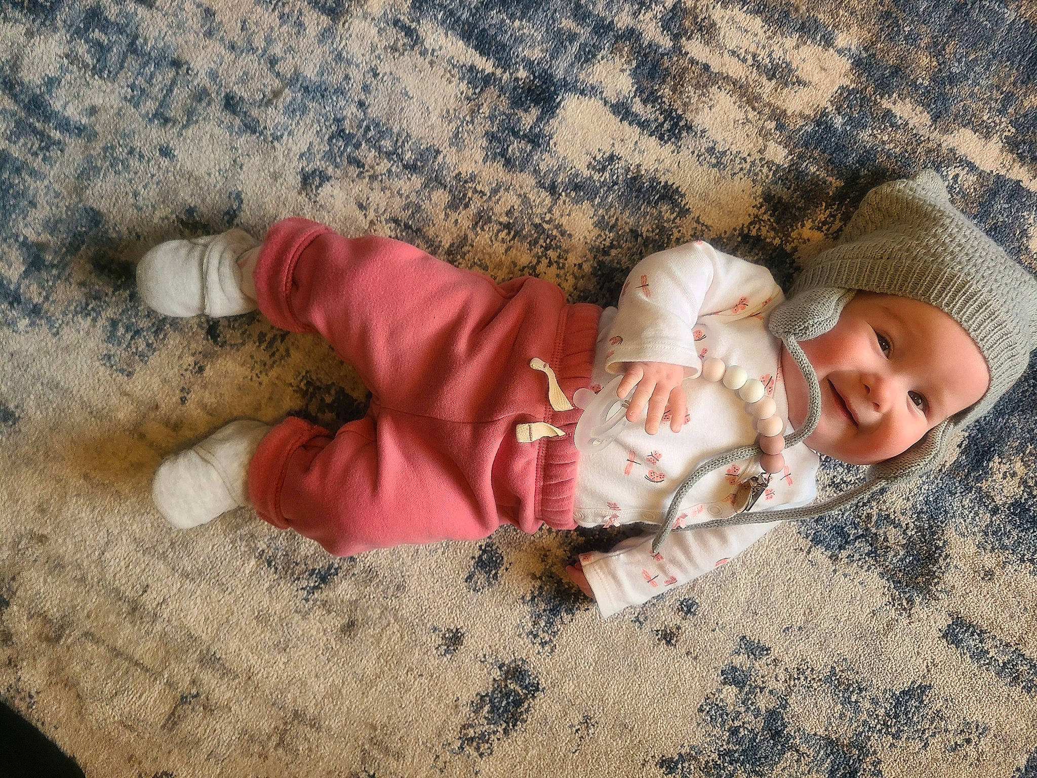 Aviana is registered to the contest to win money with this photo: baby, baby_toddler_clothing, beauty, child, comfort, fawn, finger, flooring, foot, grass, headwear, human_body, human_leg, joy, linens, pattern, person, sand, skin, textile