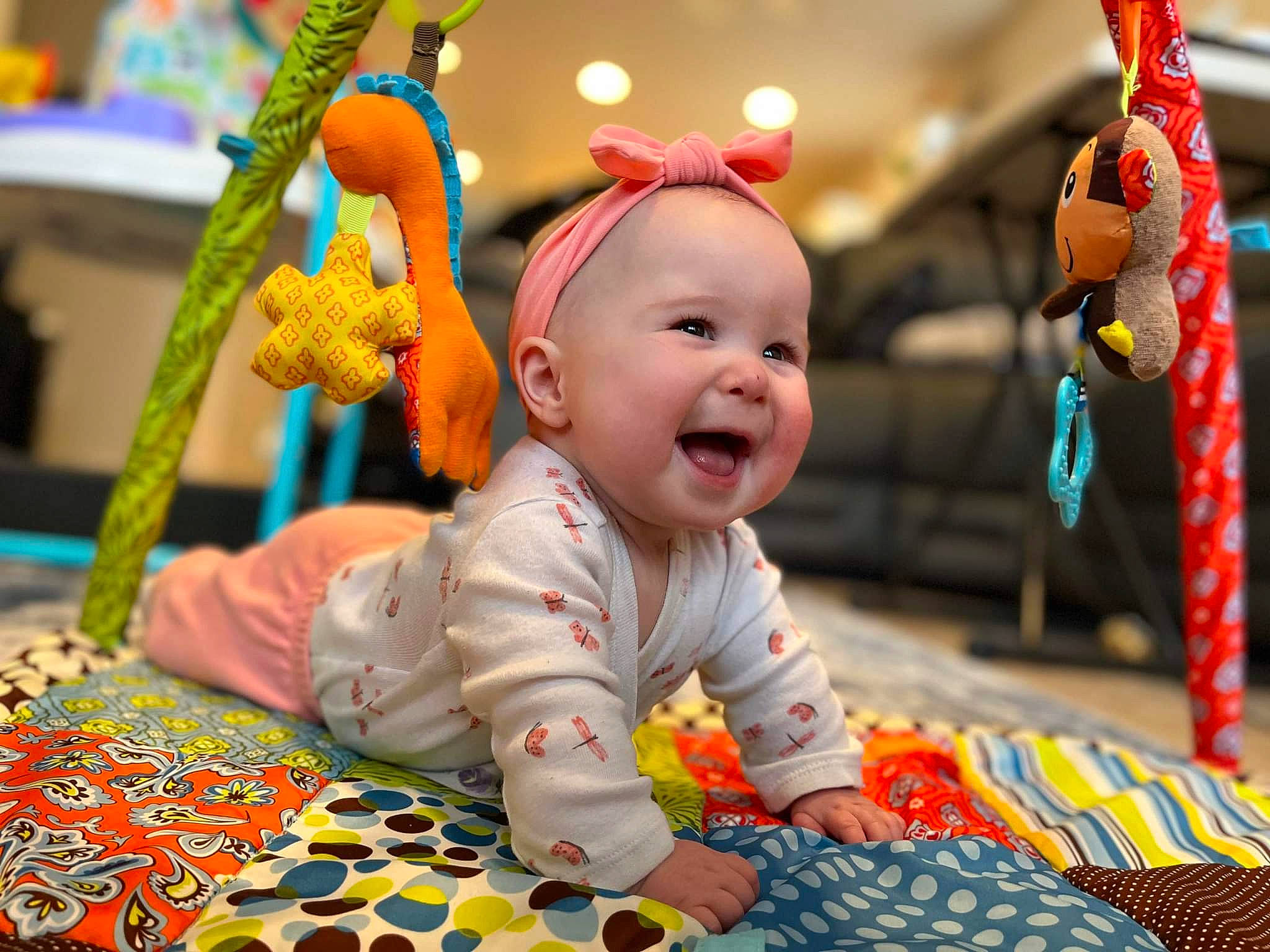 Aviana is registered to the contest to win money with this photo: baby, baby_toddler_clothing, child, event, flooring, fun, happy, holiday, leisure, orange, person, photograph, play, red, room, smile, snapshot, textile, toddler, toy