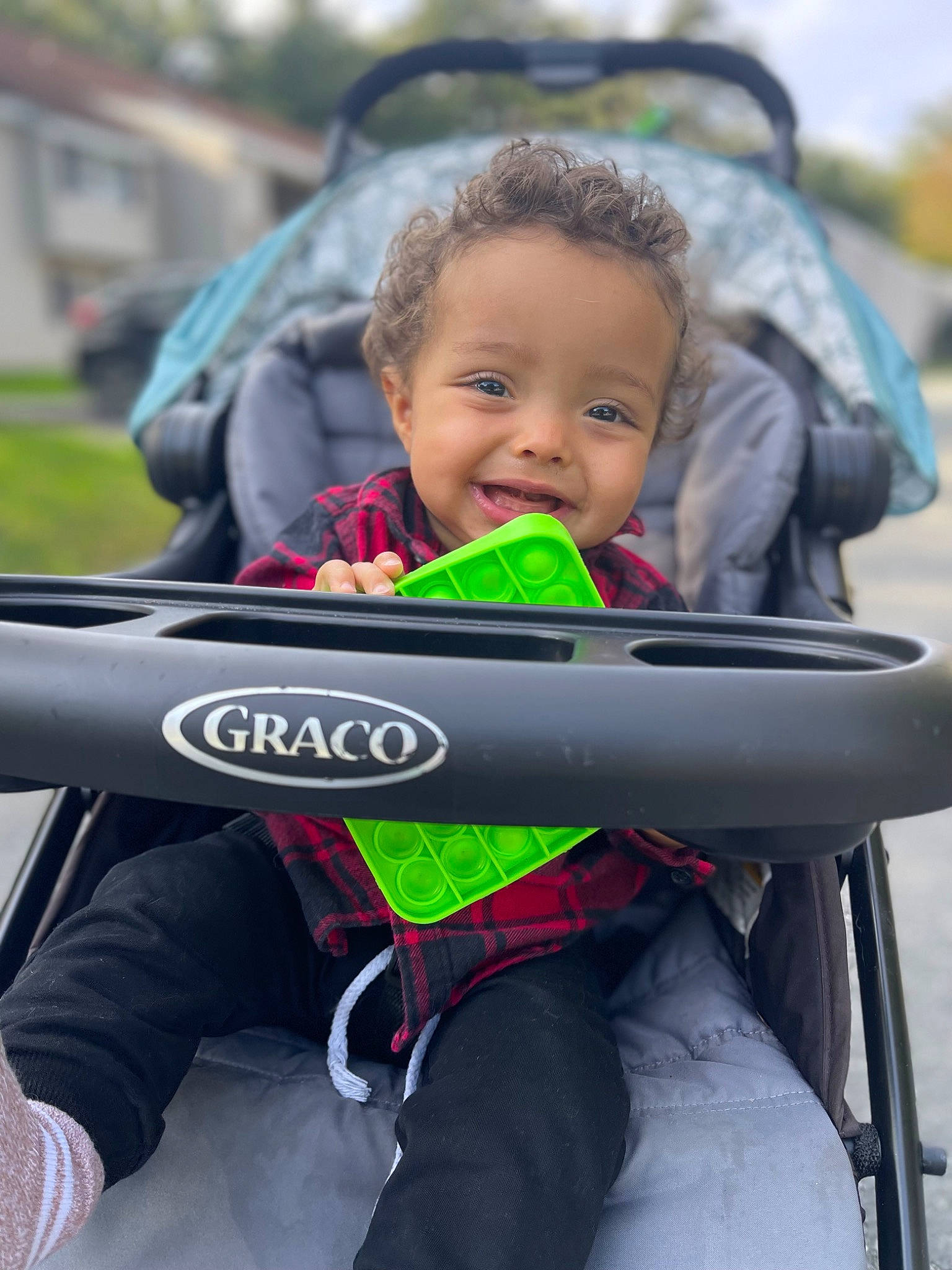 Spencer joined the competition — help win amazing prizes! baby, baby_carriage, baby_products, child, face, fun, grass, happy, joy, leisure, motor_vehicle, people_in_nature, person, personal_protective_equipment, recreation, sitting, sky, smile, toddler, travel