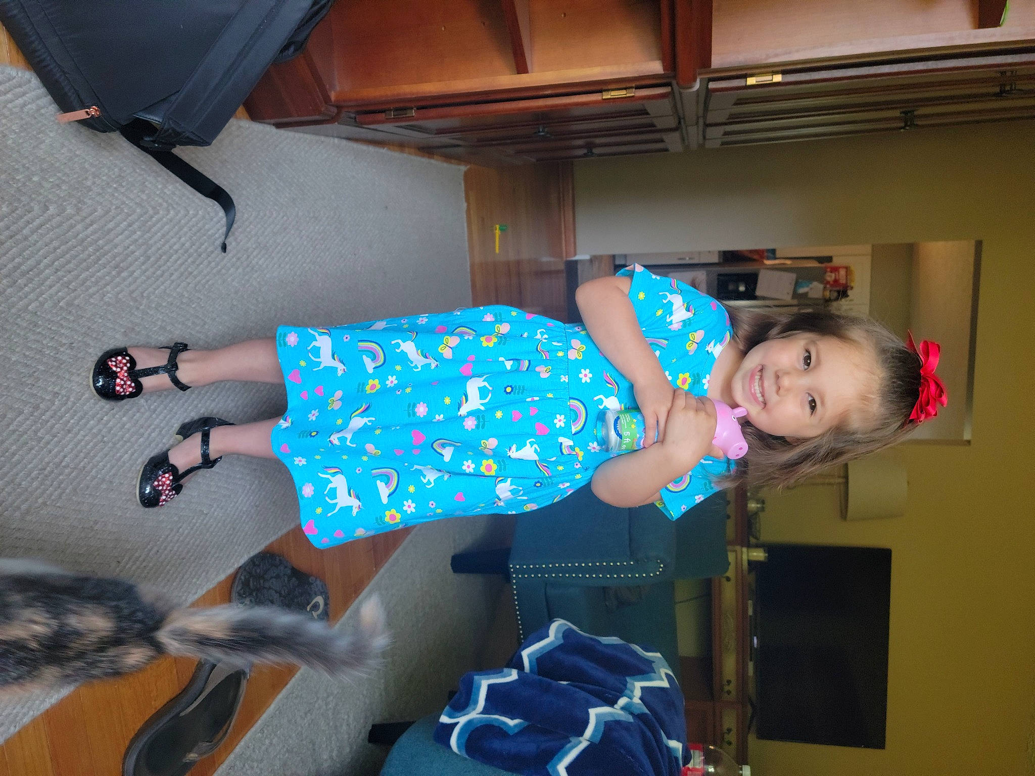 Maleah is registered to the contest to win money with this photo: baby_toddler_clothing, child, comfort, dress, electric_blue, flooring, foot, fun, hat, human_leg, joint, joy, knee, leisure, pattern, person, room, sandal, sitting, t_shirt