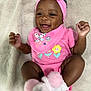 Kaydence is registered to the contest to win money with this photo: baby, smiling, pink_clothing, headband, socks, infant, happy, cute, lying_down, blanket, child, portrait, indoors, closeup, cheerful, young, fun, adorable, fashion, soft