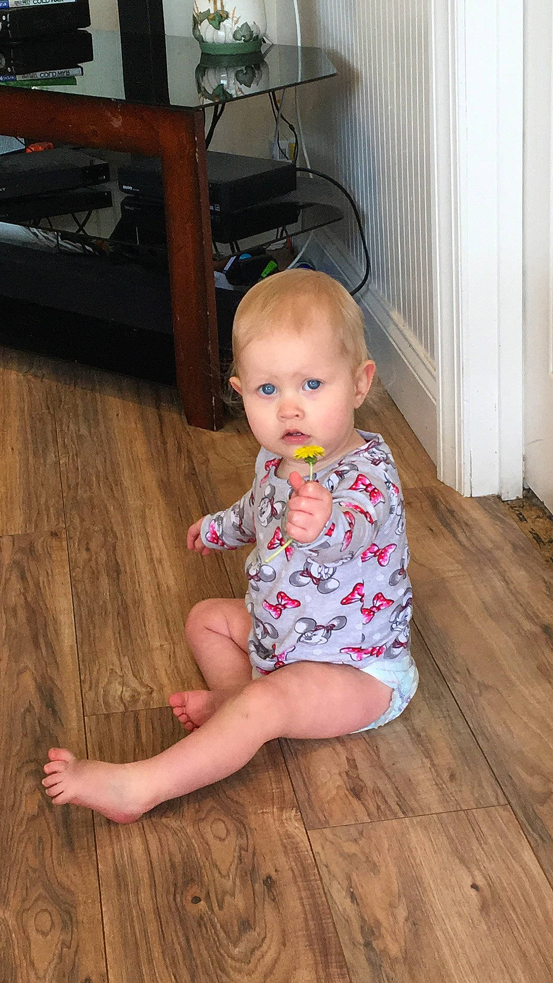 Karmyn is registered to the contest to win money with this photo: baby, baby_toddler_clothing, cheek, eye, floor, flooring, foot, hair, hardwood, head, human_body, human_leg, knee, laminate_flooring, leg, person, sleeve, thigh, toddler, trunk