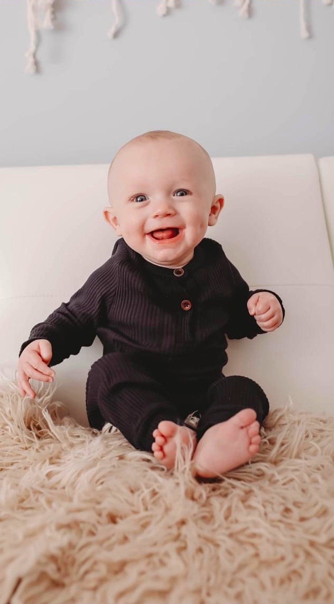 Keagan is registered to the contest to win money with this photo: baby, baby_toddler_clothing, cheek, collar, comfort, dress, face, facial_expression, finger, flash_photography, happy, human_body, iris, joy, leg, outerwear, person, pink, skin, sleeve