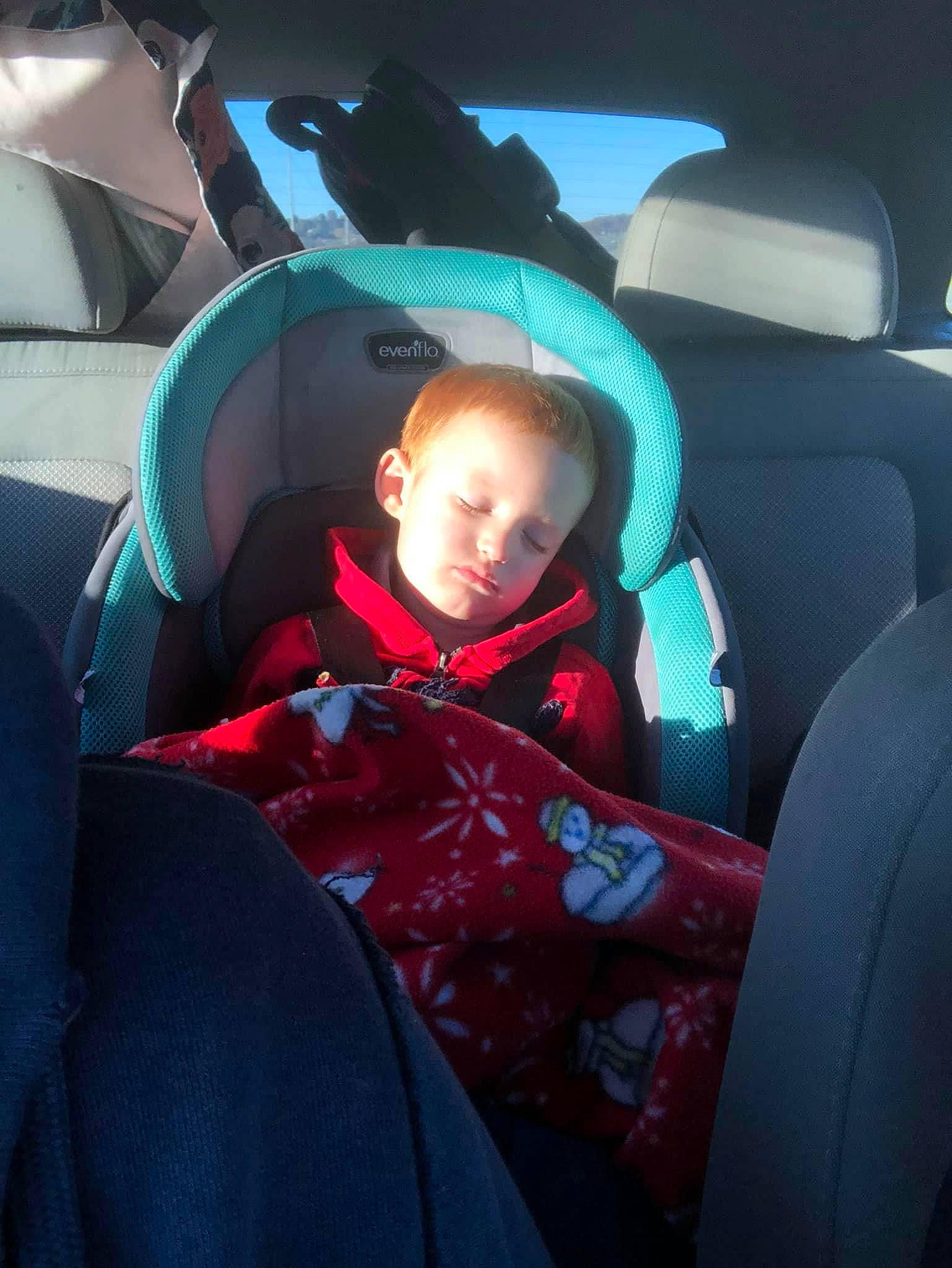 Easton is registered to the contest to win money with this photo: air_travel, auto_part, automotive_design, automotive_exterior, automotive_window_part, baby, car_seat, car_seat_cover, child, comfort, electric_blue, family_car, head_restraint, mode_of_transport, motor_vehicle, person, steering_part, toddler, vehicle, vehicle_door