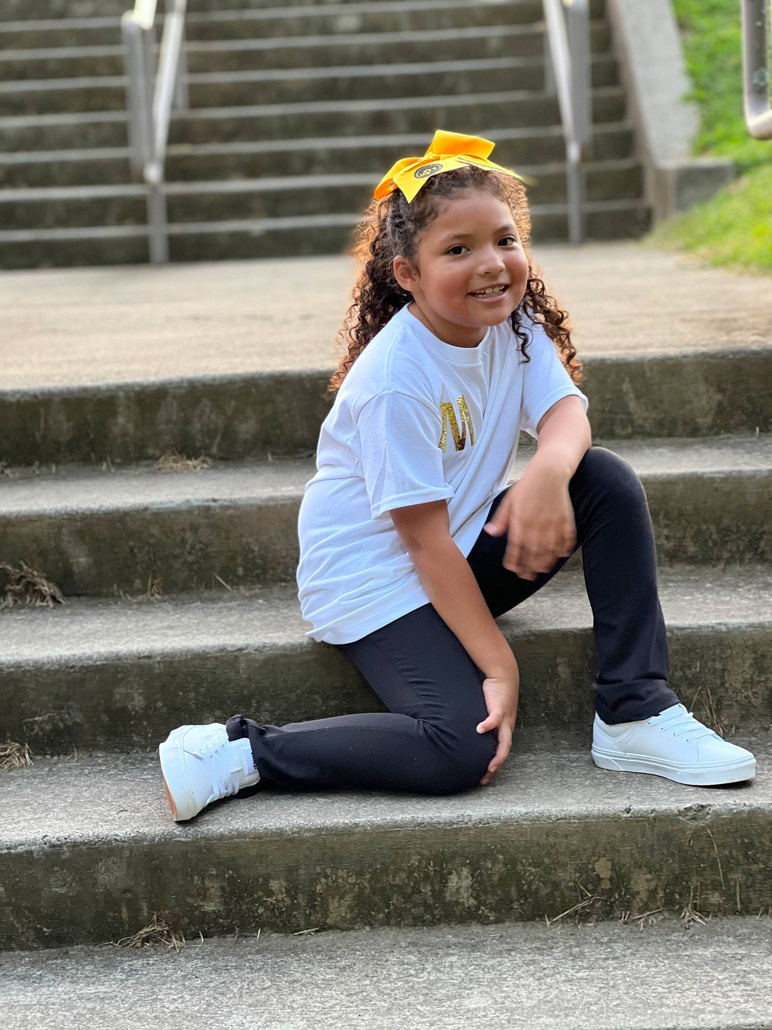 Miya is registered to the contest to win money with this photo: blond, brown_hair, denim, electric_blue, footwear, fun, grass, happy, human_leg, joy, knee, leisure, long_hair, person, recreation, shoe, sitting, smile, sneakers, sportswear