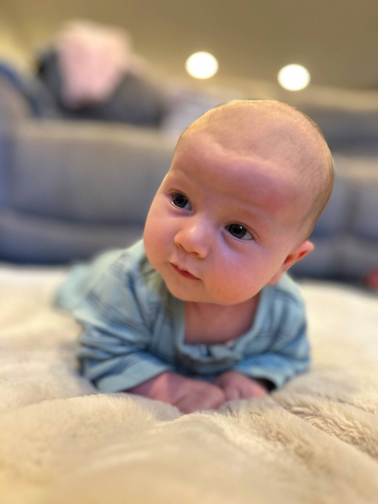 Cameron is registered to the contest to win money with this photo: baby, baby_toddler_clothing, cheek, chin, comfort, flash_photography, flooring, fun, fur, happy, hardwood, iris, linens, nose, person, portrait_photography, room, sitting, sleeve, toddler