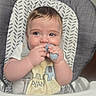 Theo joined the competition — help win amazing prizes! baby, bib, child, clothing, cute, expression, face, feeding, food, hands, high_chair, home, indoor, infant, messy, portrait, seat, teether, teething, young_child