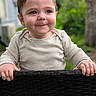 Theo joined the competition — help win amazing prizes! baby, child, smile, face, hands, wicker, basket, outdoor, greenery, curly_hair, cute, portrait, infant, young_child, soft_light, expression, closeup, nature, casual_clothing, happy