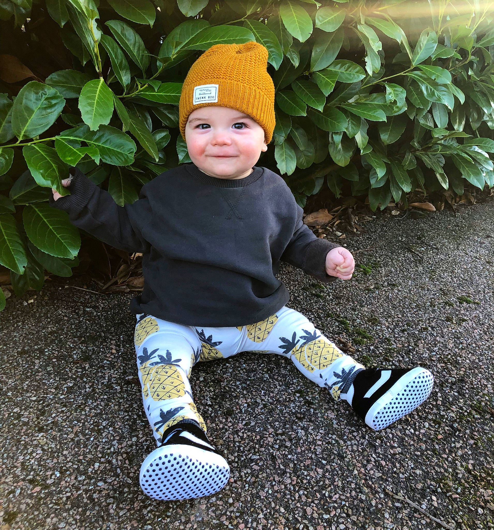 Indigo is registered to the contest to win money with this photo: baby, baby_toddler_clothing, beanie, cap, child, cool, crochet, hat, headgear, headwear, joy, knit_cap, outerwear, person, plant, play, shoe, sitting, toddler, yellow