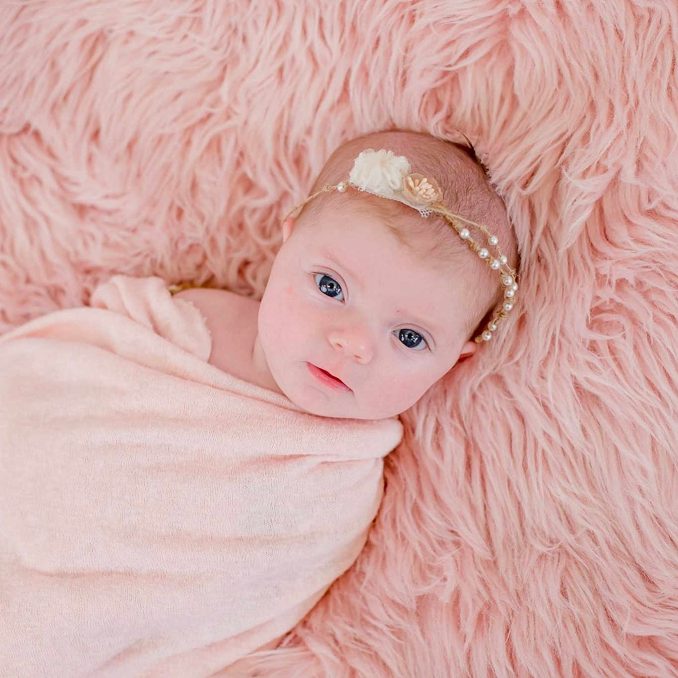 Preslee is registered to the contest to win money with this photo: art, baby, cheek, child, ear, eye, face, fur, hair_accessory, head, headgear, linens, lip, peach, photography, pink, portrait, skin, textile, toddler