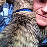 Timber joined the competition — help win amazing prizes! cat, tabby_cat, fluffy, fur, blue_collar, pet, person, face, smiling, selfie, close_up, cuddling, indoor, cozy, blanket, couch, home, portrait, whiskers, relaxed