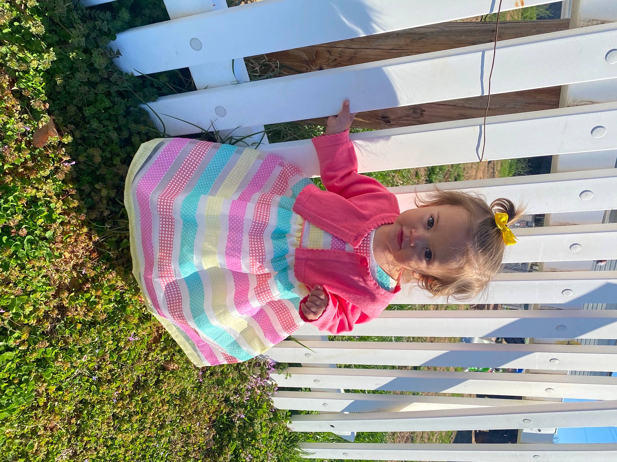 Emma Grace joined the competition — help win amazing prizes! baby_toddler_clothing, building, child, fun, grass, happy, leisure, magenta, pattern, people_in_nature, person, plaid, plant, tartan, toddler, tree, window
