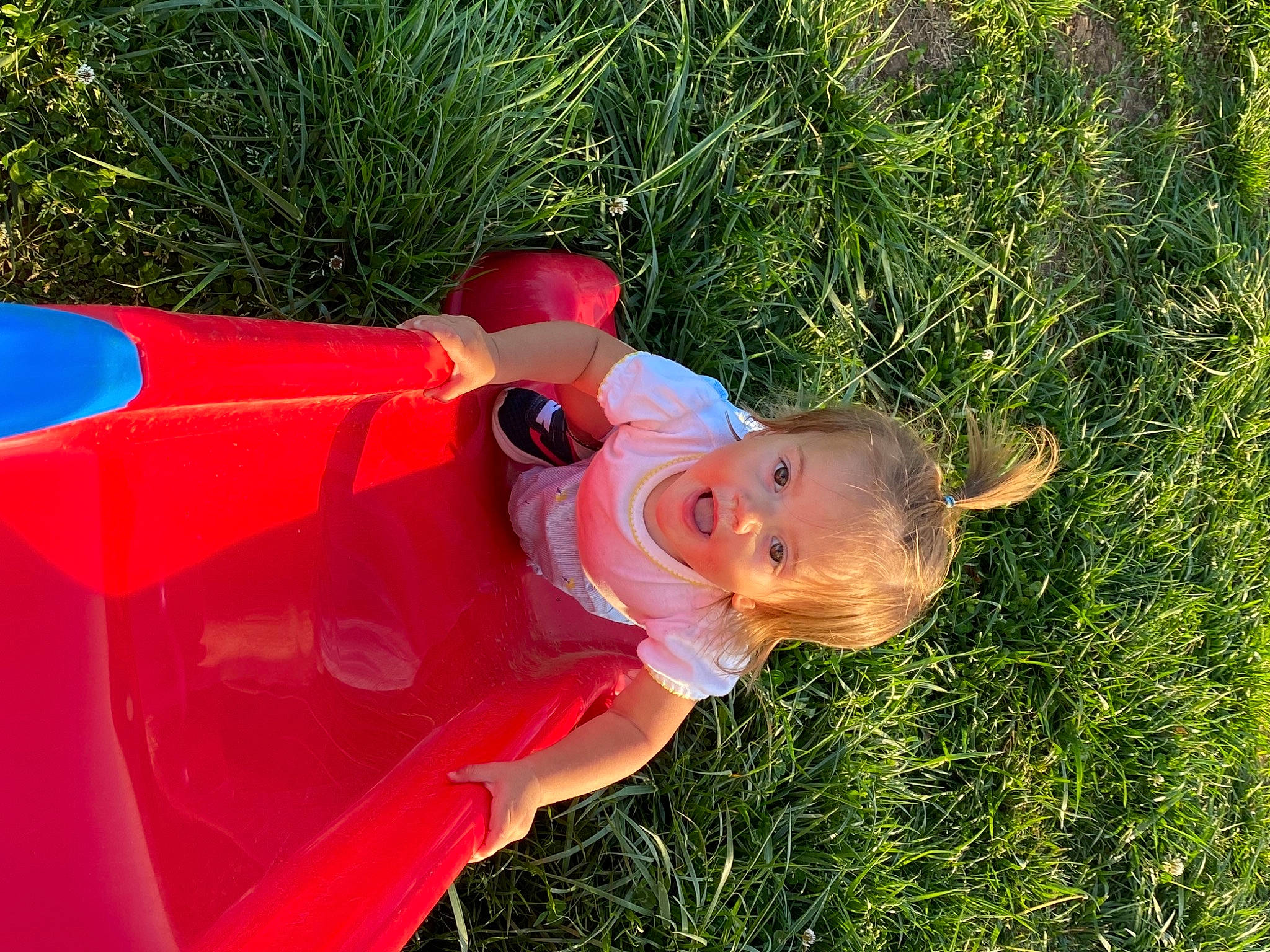 Emma Grace is registered to the contest to win money with this photo: baby, baby_toddler_clothing, carmine, child, fun, grass, grass_family, happy, hat, lawn_ornament, magenta, people_in_nature, person, plant, toddler, yard