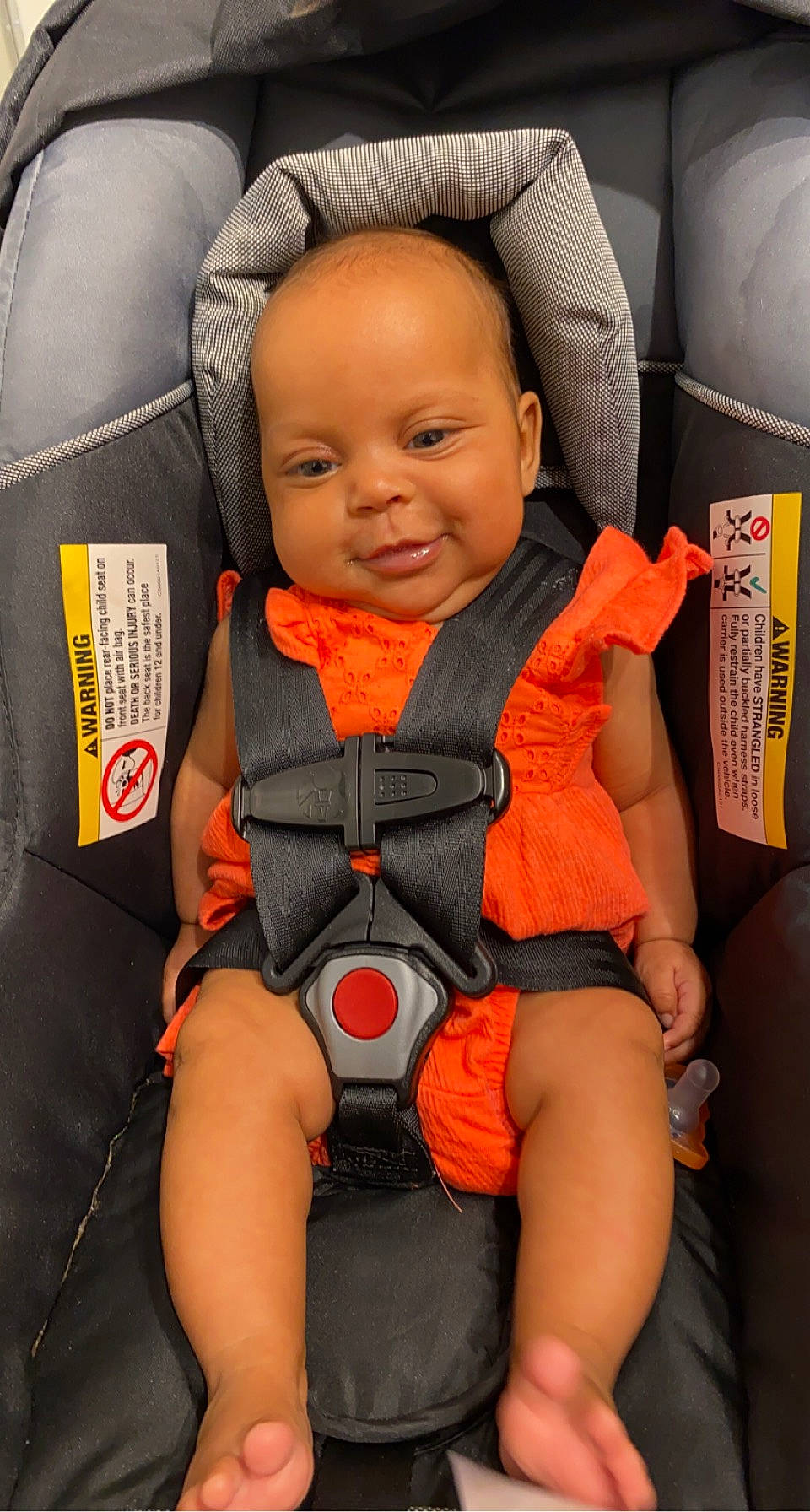Annalise joined the competition — help win amazing prizes! auto_part, baby, baby_carriage, baby_products, baby_safety, baby_toddler_clothing, car_seat, cheek, child, comfort, fun, human_leg, joy, knee, orange, person, personal_protective_equipment, seat_belt, sitting, skin