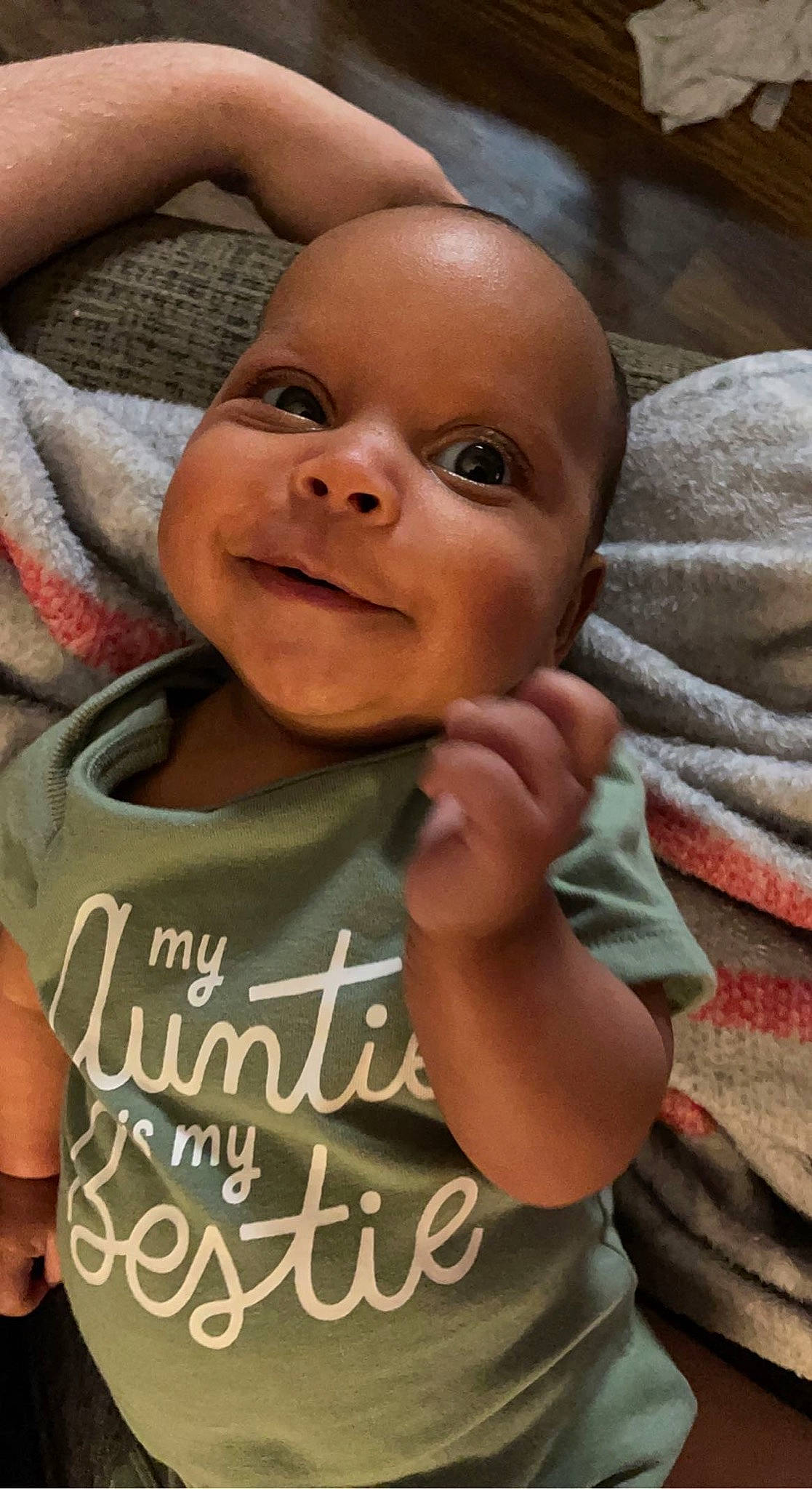 Annalise is registered to the contest to win money with this photo: baby, baby_toddler_clothing, cheek, chin, eye, facial_expression, forehead, gesture, hand, happy, head, joint, lip, mouth, muscle, nose, person, skin, sleeve, smile