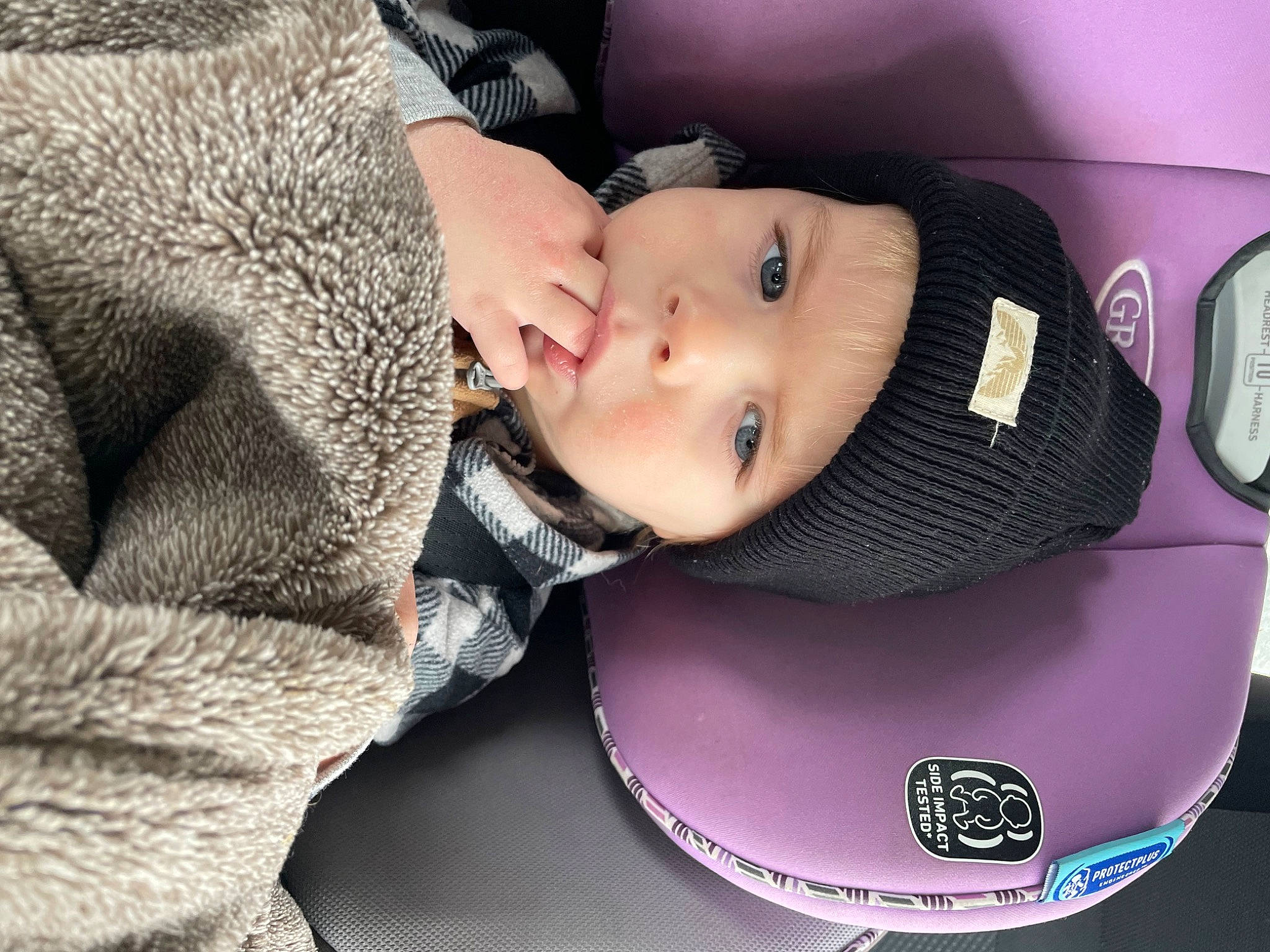 Asher is registered to the contest to win money with this photo: auto_part, automotive_lighting, automotive_wheel_system, baby, baby_carriage, baby_products, baby_toddler_clothing, bumper, car_seat, cheek, child, comfort, eyebrow, eyelash, family_car, fashion_accessory, headwear, luxury_vehicle, person, sitting