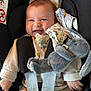 baby, infant, car_seat, smiling, pacifier, plush_toy, bunny, clothing, seatbelt, child, cute, happy, indoor, person, young_child, sitting, comfort, soft_toy, secured, portrait