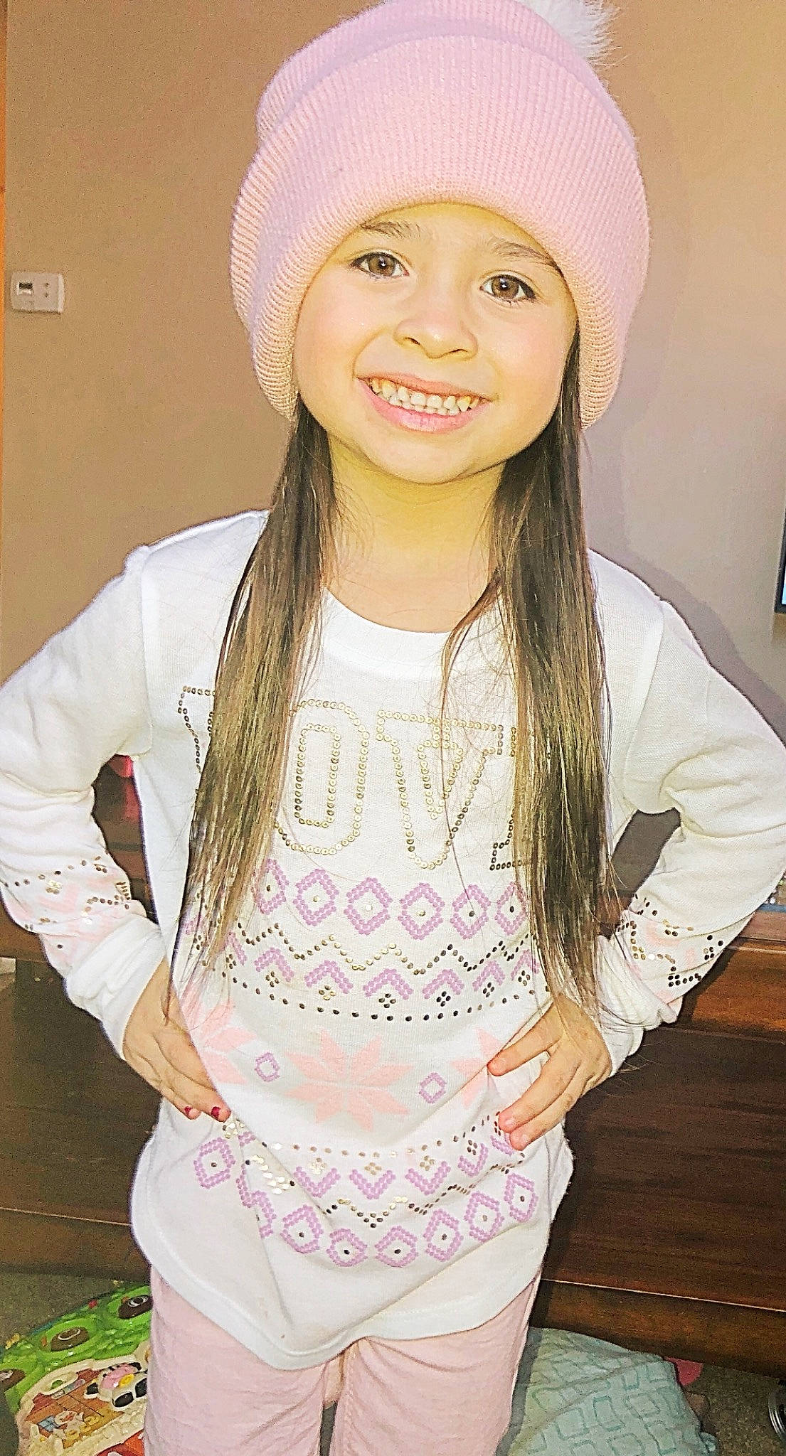 Miabella is registered to the contest to win money with this photo: beanie, bonnet, cap, child, child_model, clothing, fashion_accessory, hat, headgear, joy, knit_cap, lip, long_hair, person, pink, smile, sun_hat, white