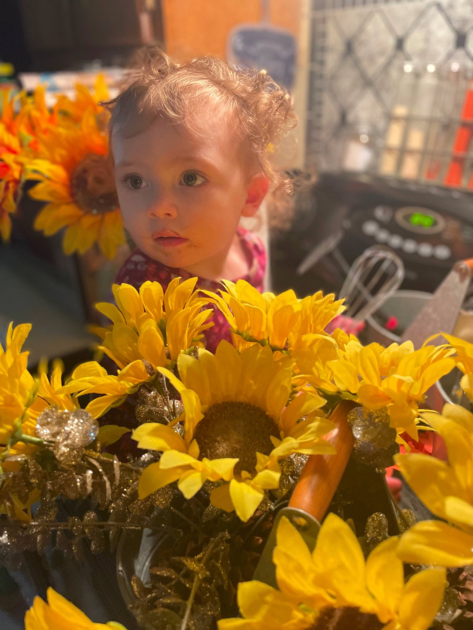 Meredith joined the competition — help win amazing prizes! annual_plant, event, eye, floral_design, flower, flower_arranging, flowering_plant, fun, happy, headgear, iris, light, orange, people, person, petal, photograph, plant, sunflower, toddler