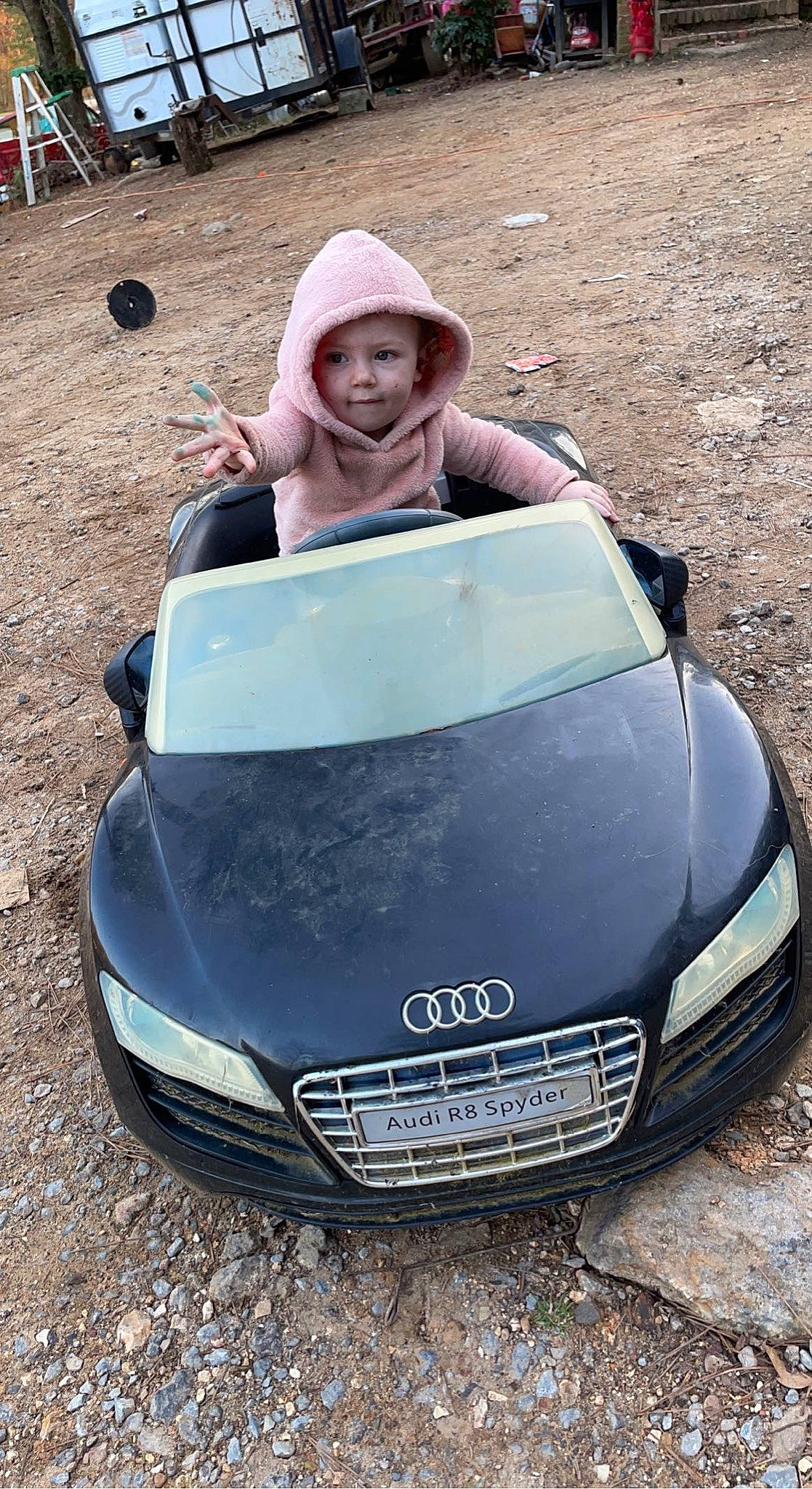 Meredith is registered to the contest to win money with this photo: automotive_design, automotive_exterior, automotive_lighting, automotive_mirror, automotive_tire, bumper, car, fender, grille, hat, head, headlamp, headwear, hood, motor_vehicle, person, personal_luxury_car, photograph, sun_hat, vehicle