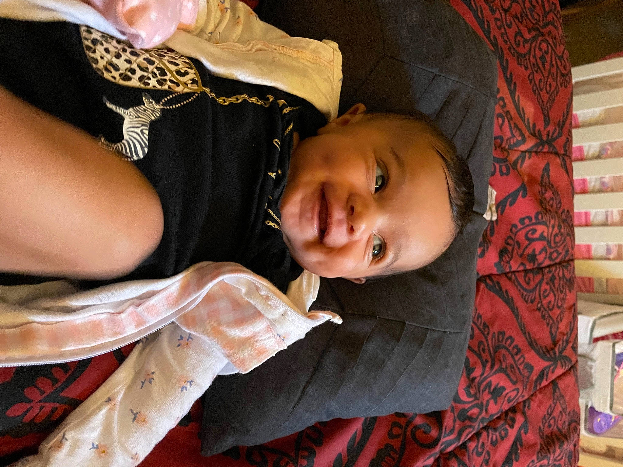 Elise is registered to the contest to win money with this photo: baby, cheek, child, dress, eye, face, fun, hairstyle, happy, hat, orange, pattern, person, room, skin, smile, temple, toddler, tradition, tree