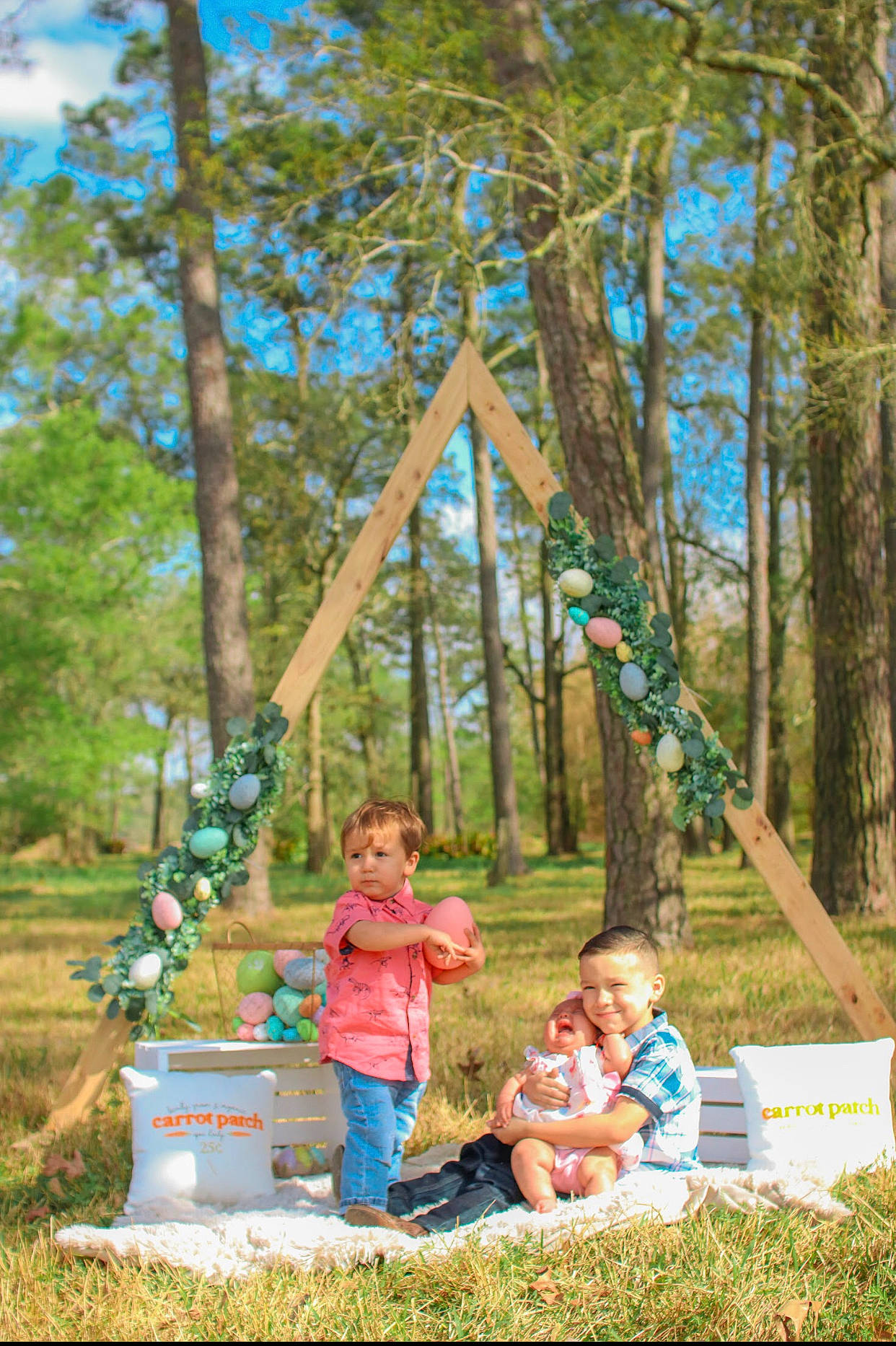 Alaina joined the competition — help win amazing prizes! child, forest, fun, garden, grass, happy, joy, leaf, leisure, people_in_nature, person, plant, pole, recreation, shorts, sitting, sky, toddler, tree, vacation