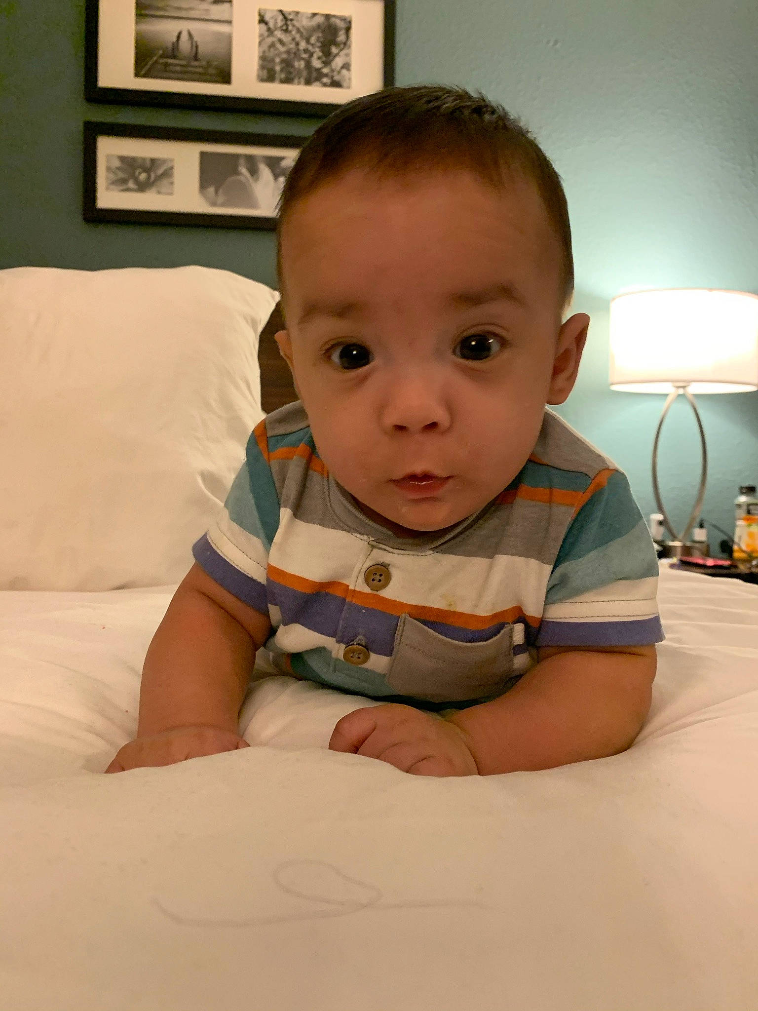 Yeikiel is registered to the contest to win money with this photo: baby, baby_toddler_clothing, cheek, child, chin, comfort, finger, floor, flooring, fun, hair, lamp, neck, nose, person, picture_frame, sitting, skin, sleeve, t_shirt