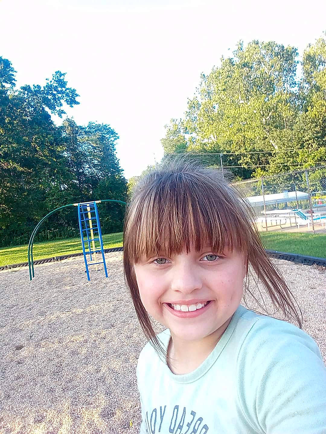 Kaylee is registered to the contest to win money with this photo: bangs, chin, cool, electric_blue, fashion_accessory, fun, grass, happy, headpiece, hime_cut, joy, leisure, people_in_nature, person, plant, recreation, sky, smile, t_shirt, toddler