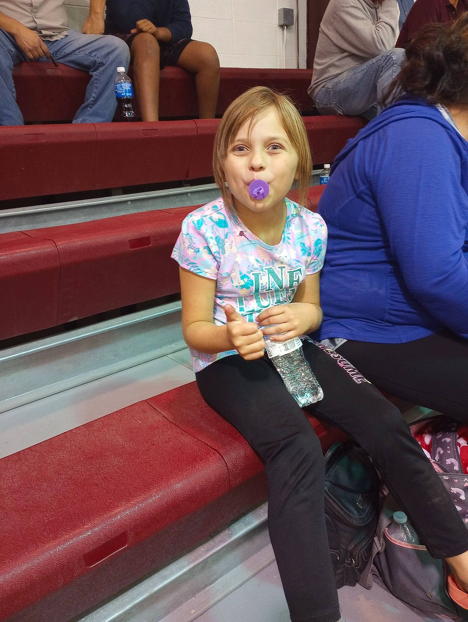 Kaylee joined the competition — help win amazing prizes! electric_blue, event, flooring, fun, human_leg, joint, knee, lap, leggings, leisure, luggage_and_bags, luxury_vehicle, magenta, person, recreation, sitting, sportswear, t_shirt, thigh